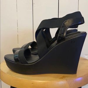 Black wedge strapped women’s shoes